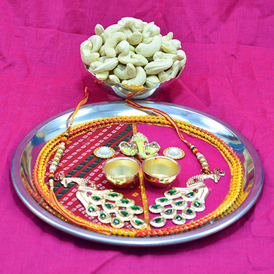 Lord Ganesha with Peacock on Colorful Base Antique Design Rakhi Pooja Thali along with Dry Fruit of Cashew