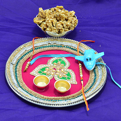 Rich Looking Pink Base Rakhi Pooja Thali with Rakhis and Akhrot Dry Fruits Hamper