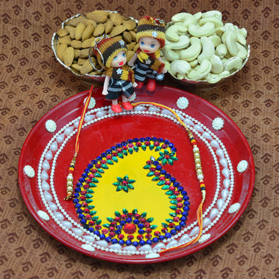 Eye Catching Crafted Rakhi Pooja Thali with Luscious Almonds and Kaju Dry Fruits