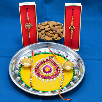 Amazing Yellow Base Crafted Pearl Pooja thali Rakhi with Delicious Almonds