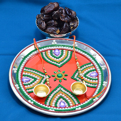 Eye Catching Rakhi Pooja thali with flavorful Cashew and Pista Dry fruits