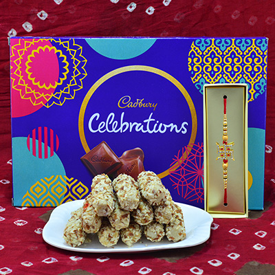 Sapid Cadbury Celebration with Delicious Kaju Badam Butterscotch Roll with Attractive Swatik Jewel Rakhi