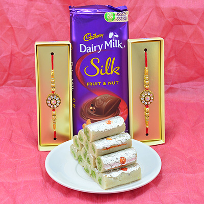 Amazing Diamond Jewel Rakhi with Delicious Cadbury Dairy Milk and Luscious Kaju Roll