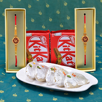 Amazing Eye Catching Sandalwood OM Divine Rakhi with succulent Kaju Gujia and yummy Nestle Kitkat Hamper