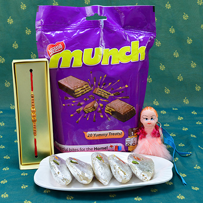 Gorgeous Beads Rakhi with barbie doll kids rakhi and Yummy Nestle Munch with delicious Kaju Gujia Hamper