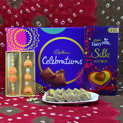Superb Eye Catching Flower Design Bhaiya Bhabhi Rakhi with Delicious Cadbury Celebrations and Luscious Anjeer Chakra