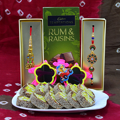 Gorgeous Diamond Jewel Bhaiya Bhabhi Rakhi with Kids Rakhi and Delicious Anjeer Chakra with Cadbury Temptations