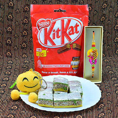 Magnificent Smily Emoji Kids Rakhi with Zardosi Rakhi along with Delicious Kaju Badam Barfi and Luscious Nestle Kitkat Hamper