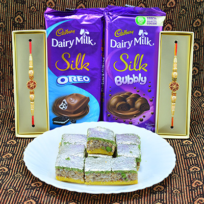 Amazing Sandalwood Swastik Rakhi with Savory Cadbury Dairy Milk with Succulent Kaju Badam Barfi