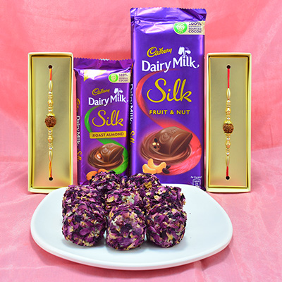 Delightful Cadbury Dairy Milk Silk with delicious Kaju Rose Laddu along with Magnificent Rudraksha Rakhi