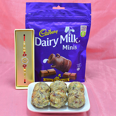 Savory Dry fruit Laddu with Luscious Cadbury Dairy Milk Minis along with Diamond Stud Rakhi Hamper