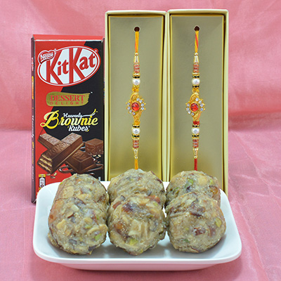 Marvelous Golden Diamond Jewel Rakhi with Yummy Nestle Kitkat Chocolate along with Piquant Mix Dry Fruit Laddu