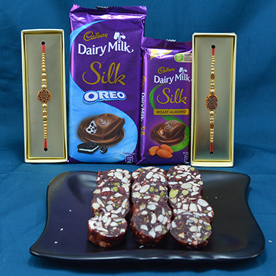 Luscious Cadbury Dairy Milk Silk Chocolates with Mouthwatering Kaju Anjeer Dry Fruits along with Golden Rakhi Hamper