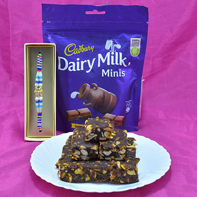 Piquant Kaju Anjeer Dry Fruit with flavorful Cadbury Dairy Milk Minis along with Magnificent Colorful Rakhi Hamper