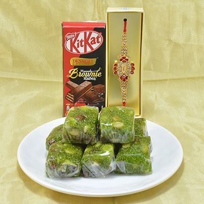 Gorgeous Oval Shape Diamond Beads Jewel Rakhi with Delicious Nestle Kitkat Chocolate along with Savory Kaju Anjeer Halwa Hamper