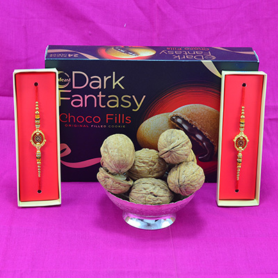 Superb Eye Catching Sandalwood beads Rakhi with Savory Walnuts and Delicious Dark Fantasy Choco Fills Hamper
