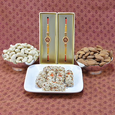 Stunning Divine Sandalwood OM Rakhi with Piquant Kaju Butterscotch Roll along with 2 Types of Tasty Dry Fruits