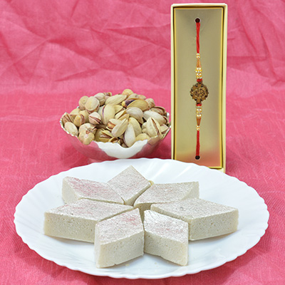 Mouthwatering Badam Barfi with Delicious Pista Dry Fruit along with Golden Beads Rakhi