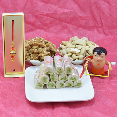 Piquant Kaju Roll with Flavorsome Badam Dry Fruit along with Divine Ganesha Rakhi and Kids Cartoon Rakhi