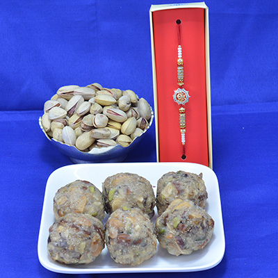 Arstocratic Kaju Dry Fruit Laddu with Delicious Pista Dry Fruit Hamper along with Attractive Rakhi Hamper