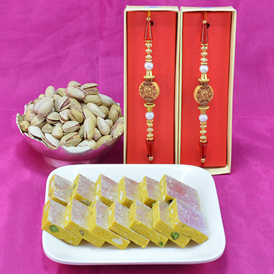 Amazing Sandalwood Beads Rakhi with Piquant Kaju Kesar Pisat Barfi and Delicious Pista Dry Fruit Hamper