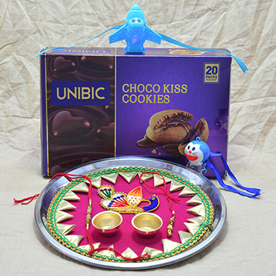 Marvelous Peacock Crafted Pooja Thali Rakhi with Luscious Choco Kiss Cookies with Kids Rakhi