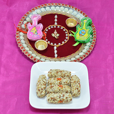 Delicious Kaju Butterscotch Roll with Eye Catching Divine Ganesha Stud Pooja Thali 