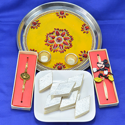 Spectacular Flower Design Crafted Pooja Thali with Savory Kaju Katli along with Rakhi