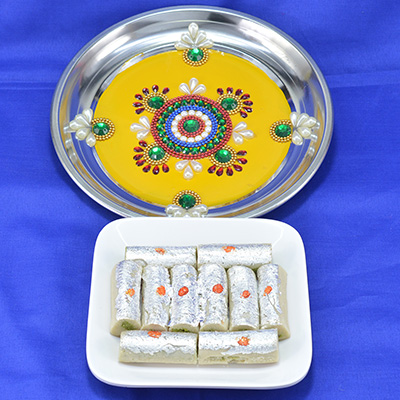 Marvellous Colorful Crafted Pooja Thali with Delicious Kaju Roll