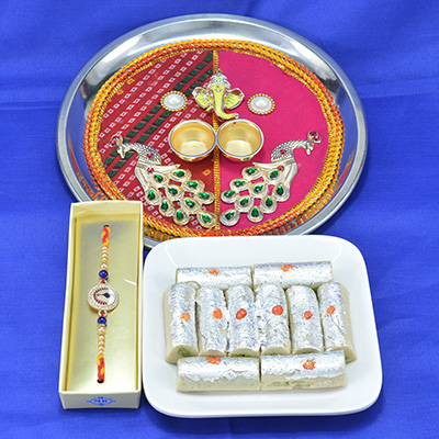Wonderful Ganesha with Mayur Traditional Pooja Thali with Tasty Fresh Kaju Roll along with Stunnig Mayur Rakhi