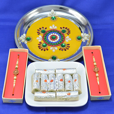 Magnificent Colorful Flower Design Pooja Thali with Luscious Kaju Roll along with Gorgeous Sandalwood Divine Rakhi