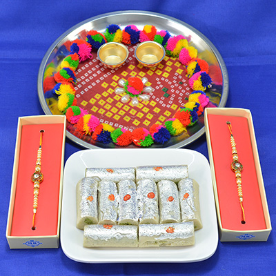 Marvellous Traditional Chunri Craftd Pooja Thali with Luscious Kaju Roll along with Golden Beads Rakhi