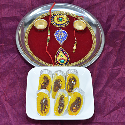 Piquant Kaju Rajbahar Sweet with Amazing Crafted Pooja Thali Hamper