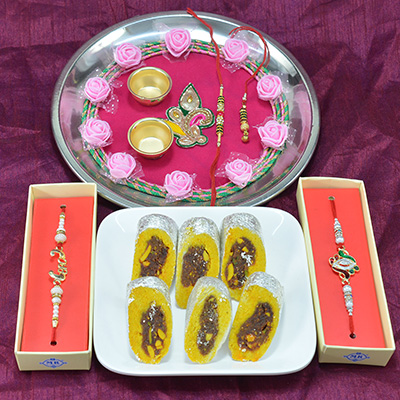 Marvelous Flower Design Pooja Thali with Delicious Kaju Rajbahar Sweet along with Gorgeous Rakhi