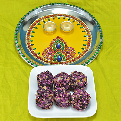 Illustrious Diamond Beads Crafted Pooja Thali with Delicious Kaju Rose Laddu 