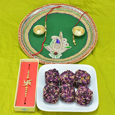 Piquant Kaju Rose Laddu with Awesome Traditional Crafted Pooja Thali along with Divine Swastik Rakhi