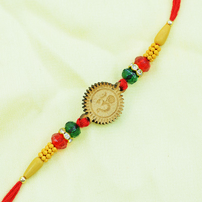 Magnificent OM Sandalwood Rakhi with Attractive Beads