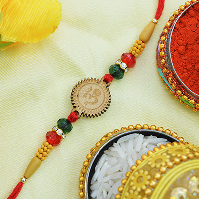 Magnificent OM Sandalwood Rakhi with Attractive Beads