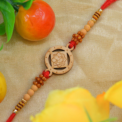 Stylish Sandalwood Ganesh Rakhi with Graceful Beads along with Silky Thread