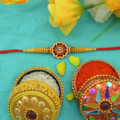 Amazing Sun Flower Shape Wooden Studded Sandalwood OM Rakhi with Tiny Shining Golden Beads