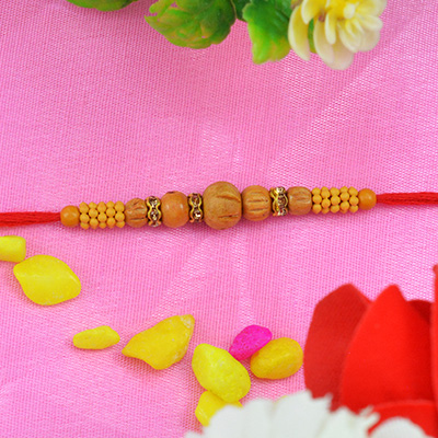 Elegant Unique Sandalwood Rakhi with Tiny Graceful Beads along with Red Silky Thread