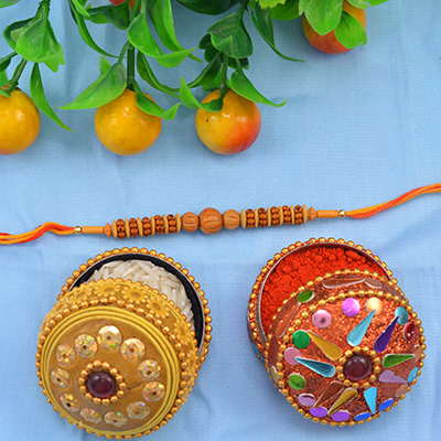Scrumptious Sandalwood Rakhi with Multi-Color Silk Thread