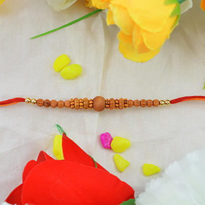 Lovely Sandalwood Rakhi with Graceful Pretty Beads