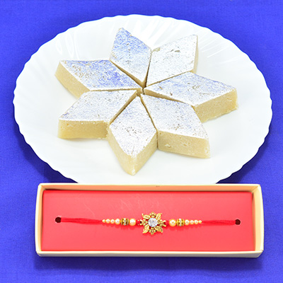 Eye Catching Golden Flower Shape Beads Rakhi with Luscious Kaju Katli Hamper