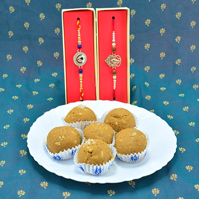 Peacock and Divine Ganesha Types Rakhis for Brother with Delicious Besan Laddu Sweet