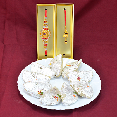Jewel Studded Attractive Looking Rakhi for Brother and Bhabhi with Delicious and Tasty Sweet of Kaju Gujia