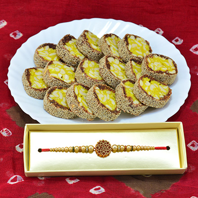 Amazing Looking Liner Om Rakhi for Brother with Anjeer Chakra Sweet of Cashew