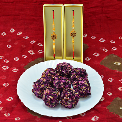 Goregious Swastik Multicolor Beads Rakhi with Tasty Kaju Rose Laddu