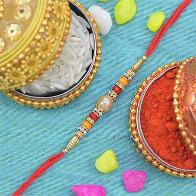 Center Base Pearl Rakhi With Multicolor and Golden Beads 