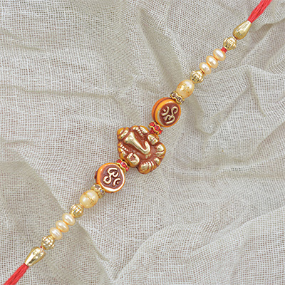 Center Base Lord Ganesha with Om And Pearls Rakhi